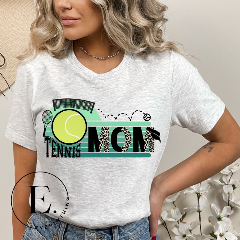Serve up some style with our Tennis Mom shirt sublimation download. This PNG file is perfect for sublimation printing, featuring a trendy design that celebrates the pride of being a tennis mom. Show your support in fashion and make a statement on and off the court. PNG on a grey shirt. 