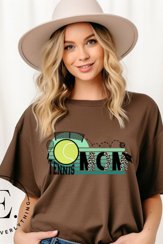 Serve up some style with our Tennis Mom shirt sublimation download. This PNG file is perfect for sublimation printing, featuring a trendy design that celebrates the pride of being a tennis mom. Show your support in fashion and make a statement on and off the court. PNG on a brown shirt. 