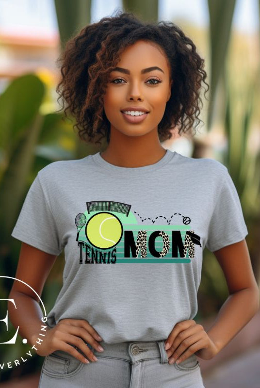 Serve up style and support with our chic tennis mom shirt. Designed for moms cheering on their tennis prodigies on a grey shirt. 
