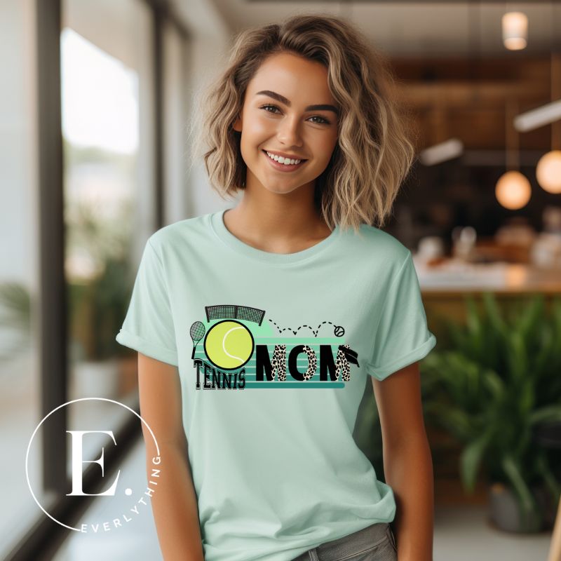 Serve up style and support with our chic tennis mom shirt. Designed for moms cheering on their tennis prodigies on a mint shirt. 