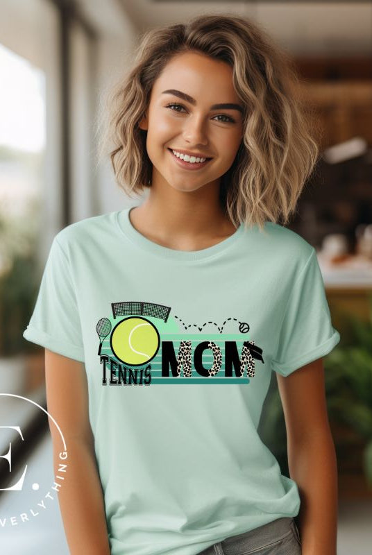 Serve up some style with our Tennis Mom shirt sublimation download. This PNG file is perfect for sublimation printing, featuring a trendy design that celebrates the pride of being a tennis mom. Show your support in fashion and make a statement on and off the court. PNG on a mint shirt. 