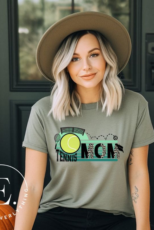 Serve up some style with our Tennis Mom shirt sublimation download. This PNG file is perfect for sublimation printing, featuring a trendy design that celebrates the pride of being a tennis mom. Show your support in fashion and make a statement on and off the court. PNG on a green shirt. 