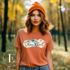 Express gratitude in style with our charming t-shirt. This design radiates autumn appreciation, featuring three pastel pumpkins and the word 'thankful' gracefully woven through the middle on an orange shirt. 