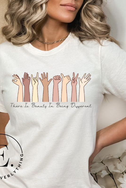 Celebrate diversity with this inspiring shirt, which features hands of different ethnicities and boldly declares "There is beauty in being different" on a white colored shirt.