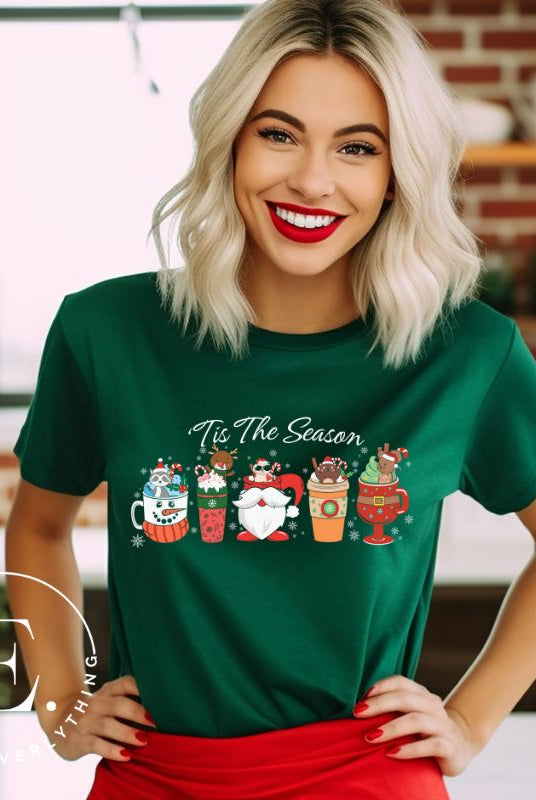 Wrap yourself in cozy holiday vibes with our Christmas coffee cup shirt. With a festive design that says "Tis The Season," this shirt captures the essence of warmth and joy. Perfect for coffee lovers who cherish the magic of the holidays on a green shirt. 