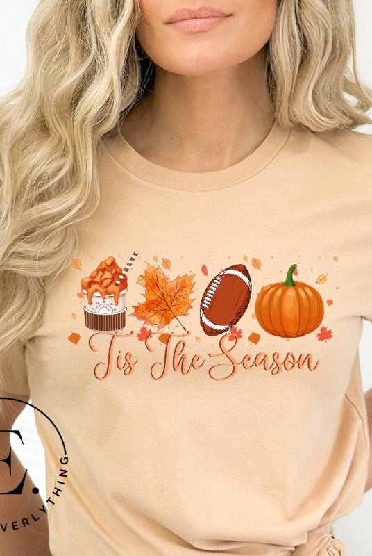 Get ready to welcome the fall season with our exclusive 'Tis The Season' football shirt! This vibrant design features fall coffee, leaves, football, and pumpkins, perfectly capturing the essence of autumn on a tan shirt. 