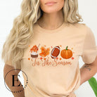 Get ready to welcome the fall season with our exclusive 'Tis The Season' football shirt! This vibrant design features fall coffee, leaves, football, and pumpkins, perfectly capturing the essence of autumn on a tan shirt. 