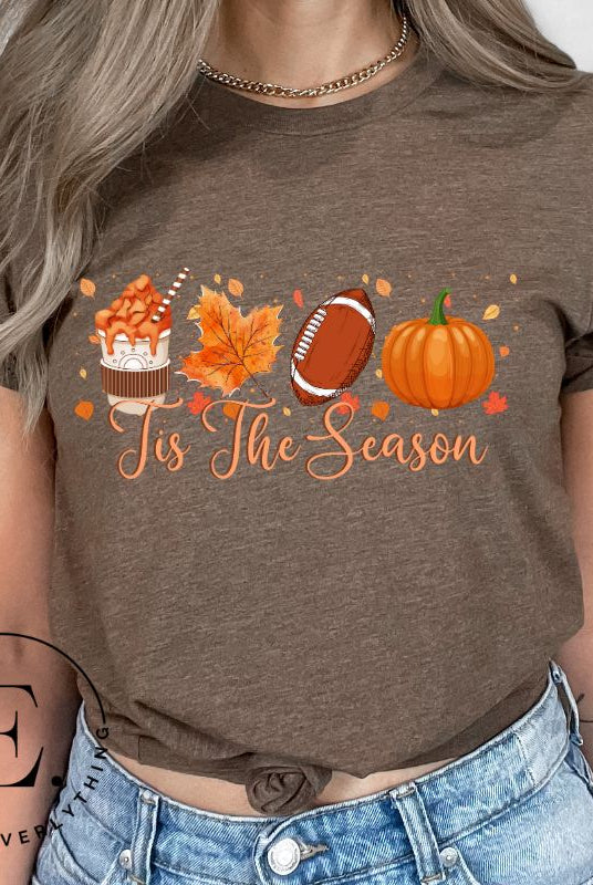 Get ready to welcome the fall season with our exclusive 'Tis The Season' football shirt! This vibrant design features fall coffee, leaves, football, and pumpkins, perfectly capturing the essence of autumn on a brown shirt. 