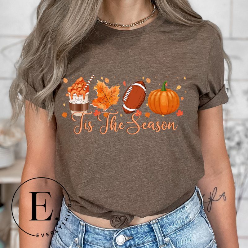 Get ready to welcome the fall season with our exclusive 'Tis The Season' football shirt! This vibrant design features fall coffee, leaves, football, and pumpkins, perfectly capturing the essence of autumn on a brown shirt. 