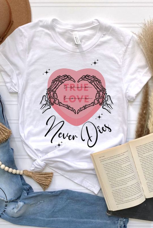 Embrace the unconventional with our Valentine's Day shirt featuring the bold statement "True Love, Never Dies" adorned with a heart and skeleton hands forming a heart shape on a white shirt. 