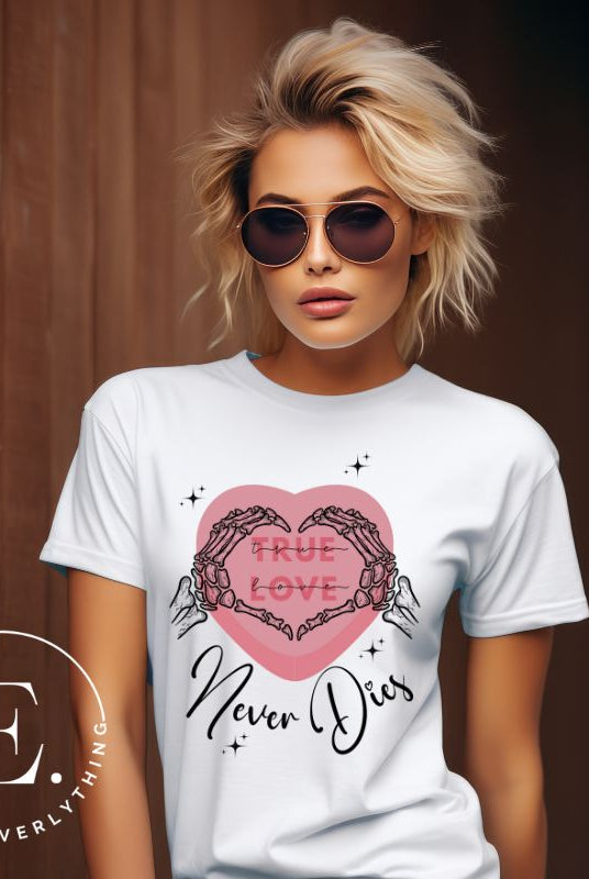 Embrace the unconventional with our Valentine's Day shirt featuring the bold statement "True Love, Never Dies" adorned with a heart and skeleton hands forming a heart shape on a white shirt. 