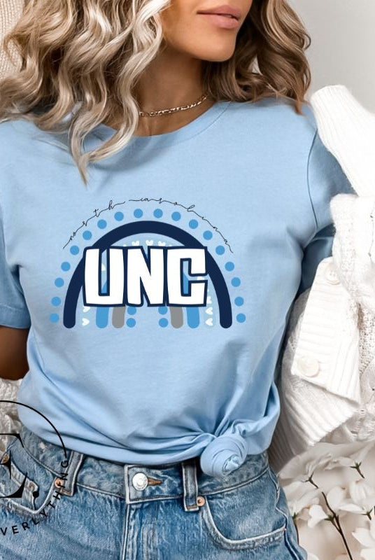Check out this eye-catching t-shirt designed, featuring the iconic UNC letters set against a vibrant rainbow backdrop. Not only does it let you show off your school spirit, it also sends a trendy and powerful school spirit vibe on a blue shirt. 