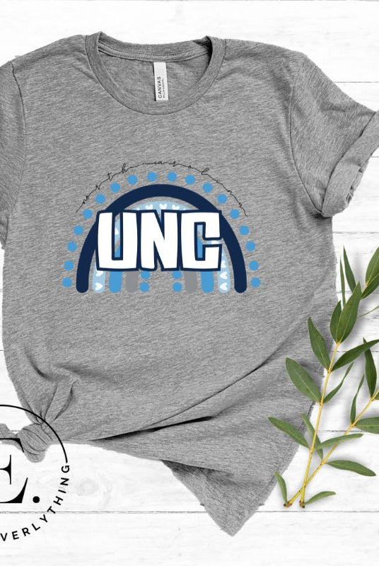 Check out this eye-catching t-shirt designed, featuring the iconic UNC letters set against a vibrant rainbow backdrop. Not only does it let you show off your school spirit, it also sends a trendy and powerful school spirit vibe on a grey shirt. 