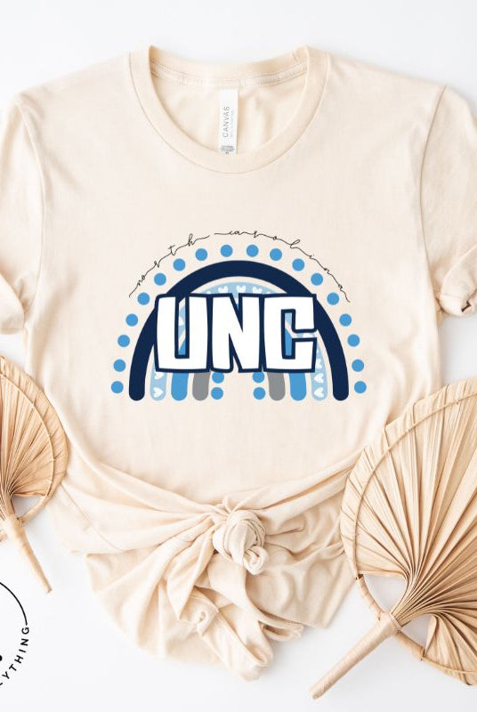 Check out this eye-catching t-shirt designed, featuring the iconic UNC letters set against a vibrant rainbow backdrop. Not only does it let you show off your school spirit, it also sends a trendy and powerful school spirit vibe on a cream shirt. 