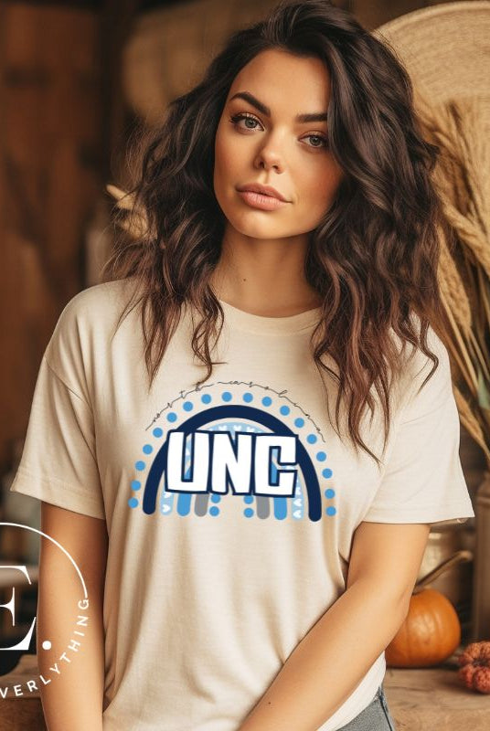 Check out this eye-catching t-shirt designed, featuring the iconic UNC letters set against a vibrant rainbow backdrop. Not only does it let you show off your school spirit, it also sends a trendy and powerful school spirit vibe on a cream shirt. 