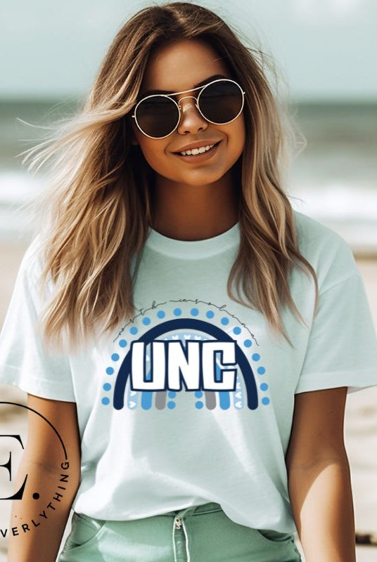 Check out this eye-catching t-shirt designed, featuring the iconic UNC letters set against a vibrant rainbow backdrop. Not only does it let you show off your school spirit, it also sends a trendy and powerful school spirit vibe on a mint shirt. 