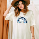 UNC - University of North Carolina design with blue and white motifs on a white shirt.