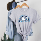 UNC - University of North Carolina design with blue and white motifs on a grey shirt.