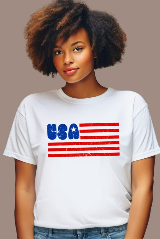 A stylish graphic tee for the USA July 4th celebration featuring a creatively designed American flag. The tee showcases the flag's stripes morphing into the text "USA" while the stars on the flag are creatively incorporated into the design, creating a unique and patriotic look on a white graphic tee.
