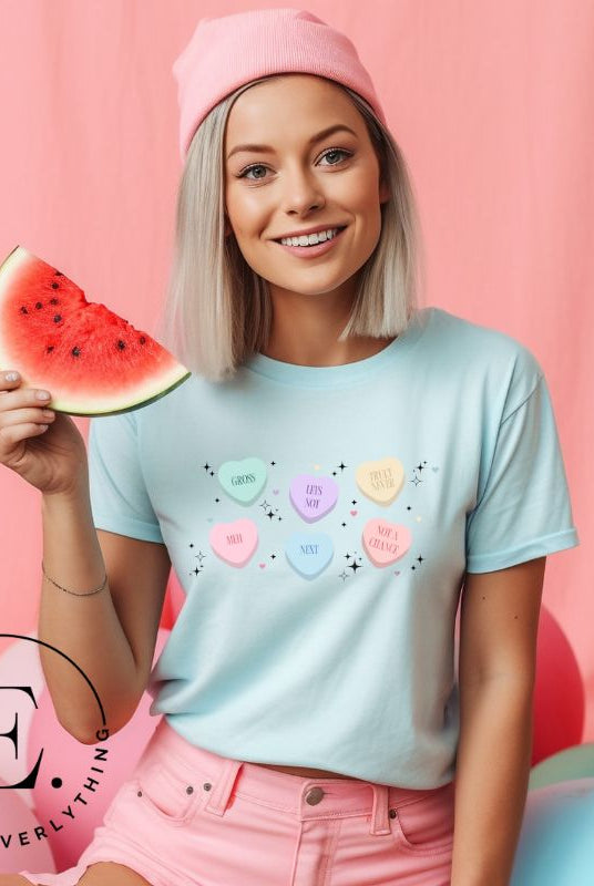 Embrace a humorous take on Valentine's Day with our shirt featuring candy hearts with unconventional messages like "Gross," "Not a Chance," "Next," "Truly Never," "Meh," "Not a Chance," and "Let's Not" on a ice blue shirt. 