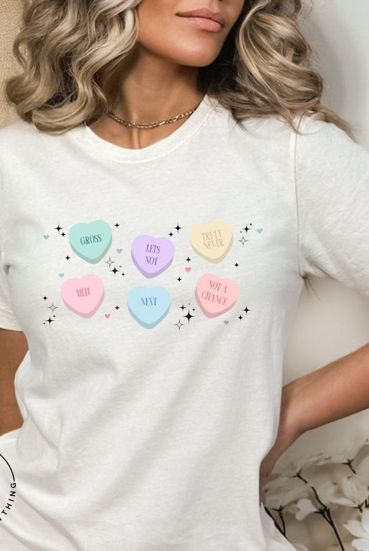 Embrace a humorous take on Valentine's Day with our shirt featuring candy hearts with unconventional messages like "Gross," "Not a Chance," "Next," "Truly Never," "Meh," "Not a Chance," and "Let's Not" on a white shirt. 