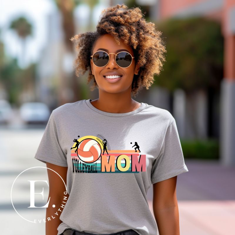 ﻿Bump, set, spike, and show your support with our Volleyball MOM shirt sublimation download. This PNG file is ideal for sublimation printing, featuring a stylish design that celebrates the pride of being a volleyball mom. PNG on a grey shirt. 