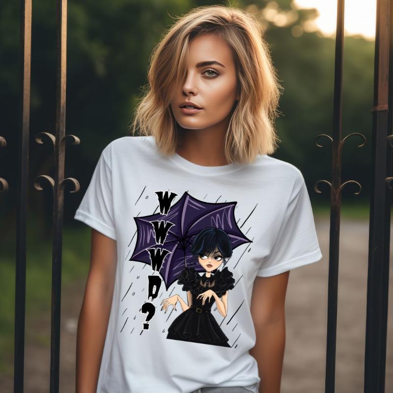 White t-shirt featuring a stylish goth girl dressed in black with a purple umbrella, along with the text "WWWD?" (What Would Wednesday Do?) in bold lettering.