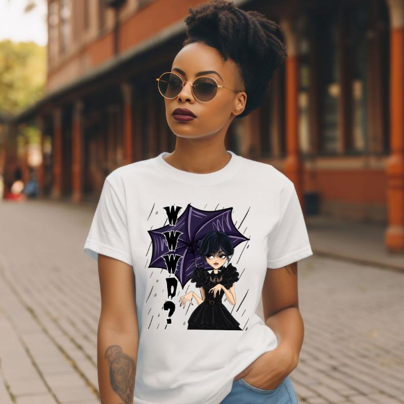 White t-shirt featuring a stylish goth girl dressed in black with a purple umbrella, along with the text "WWWD?" (What Would Wednesday Do?) in bold lettering.