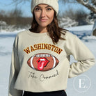 Show your support for the Washington Commanders with this stylish sweatshirt, featuring a football and fun lips and tongue design. Complete with the team's slogan "Take Command" and the distinctive Washington wordmark, on a sand sweatshirt. 