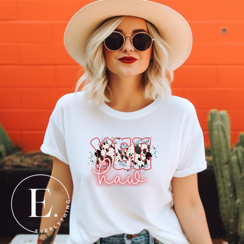 Embrace country chic with our PNG sublimation digital download! Create a stylish Western shirt featuring the word " Yeehaw" in neon pink and cowhide print. Example of PNG sublimation digital design on a white shirt.
