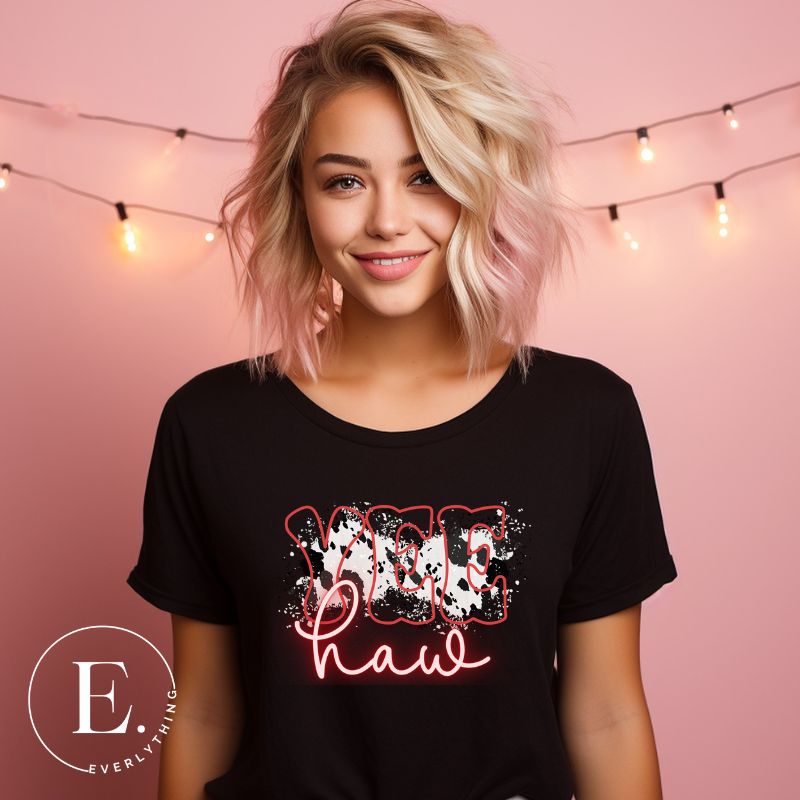 Embrace country chic with our PNG sublimation digital download! Create a stylish Western shirt featuring the word " Yeehaw" in neon pink and cowhide print. Example of PNG sublimation digital design on a black shirt. 