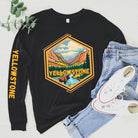 Yellowstone National Park Unisex long-sleeve shirt, with image on right arm and front on a black shirt.