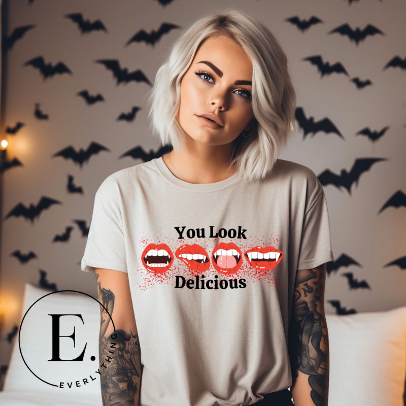 Sink your teeth into style with our 'You Look Delicious' Vampire lips Halloween shirt sublimation download. This PNG file is perfect for sublimation printing, featuring a seductively spooky design. Embrace the allure of the night and make a bold statement this Halloween. Download now and unleash your inner vampire. PNG on a grey shirt. 