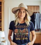 Embrace the rugged charm of the Wild West with our country western shirt featuring the iconic phrase "Western Style" set against a stunning desert background on a navy shirt. 