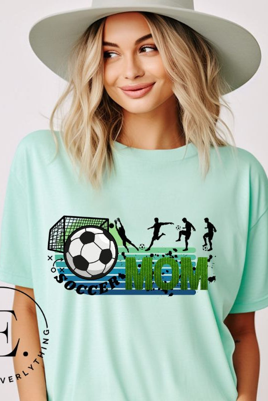 Support your soccer star on and off the field with our Soccer Mom t-shirt. Crafted with soft, breathable fabric, this shirt ensures comfort all day long. It's trendy design showcases your love for the game and your role as a proud soccer mom on a mint shirt. 
