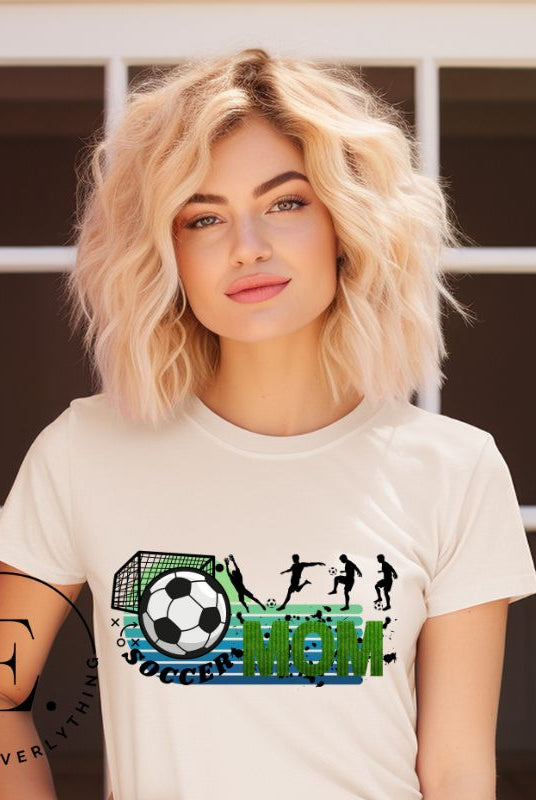 Support your soccer star on and off the field with our Soccer Mom t-shirt. Crafted with soft, breathable fabric, this shirt ensures comfort all day long. It's trendy design showcases your love for the game and your role as a proud soccer mom on a soft cream shirt. 