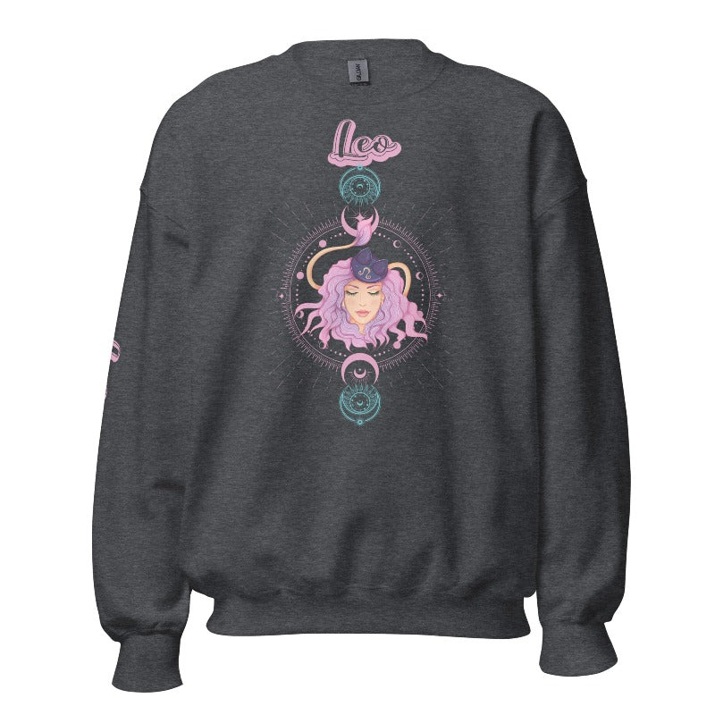 Gildan crewneck pullover sweatshirt featuring a pastel illustration of a Leo figure with flowing purple hair, surrounded by celestial elements. The word "Leo" is written in pink on the sleeve, adding a stylish touch on a dark grey sweatshirt.