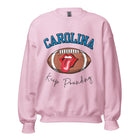 Support the Carolina Panthers in style with our modern and trendy sweatshirt featuring the team's name and powerful teams slogan, "Keep Pounding." On a pink sweatshirt. 