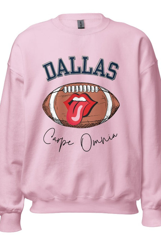 Embrace your Dallas Cowboys pride with our premium sweatshirt showcasing the team's name and empowering slogan, "Crape Omnia." On a light pink sweatshirt. 