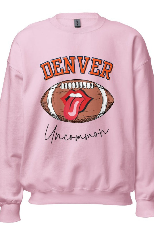 Get ready to show your support for the Denver Broncos in style with our exclusive sweatshirt featuring the team's iconic name and their slogan "uncommon." On a light pink sweatshirt. 
