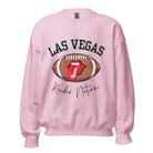 Get ready to support the Las Vegas Raiders in style with our premium sweatshirt, featuring the team's name and iconic slogan, "Raider Nation." On a pink sweatshirt. 