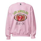 Show off your Los Angeles Chargers pride with our exclusive sweatshirt. It features the team's name and the electrifying slogan "Bolt Up." On a pink sweatshirt. 
