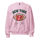 Gear up for game day with this New York Jets sweatshirt, featuring a football and playful lips and tongue design. Emblazoned with the team's rallying cry "Go Jets" and the iconic wordmark New York, on a pink sweatshirt. 