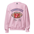 Elevate your game-day look with this Tennessee Titans sweatshirt, featuring a football and unique lips and tongue design. Complete with the team's rallying cry "Titan Up" and the iconic Tennessee wordmark, on a light pink sweatshirt. 