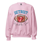 Get ready to show your Detroit Lions pride with this stylish sweatshirt featuring a football and playful lips and tongue design. Complete with the team's slogan "Defend the Den" and the iconic Detroit wordmark, this cozy pink sweatshirt.