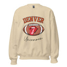 Get ready to show your support for the Denver Broncos in style with our exclusive sweatshirt featuring the team's iconic name and their slogan "uncommon." On a sand colored sweatshirt. 