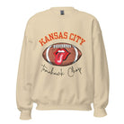 Show off your Kansas City pride with our exclusive sweatshirt that features the team's name and the spirited slogan, "Tomahawk Chop." On a sand colored sweatshirt. 