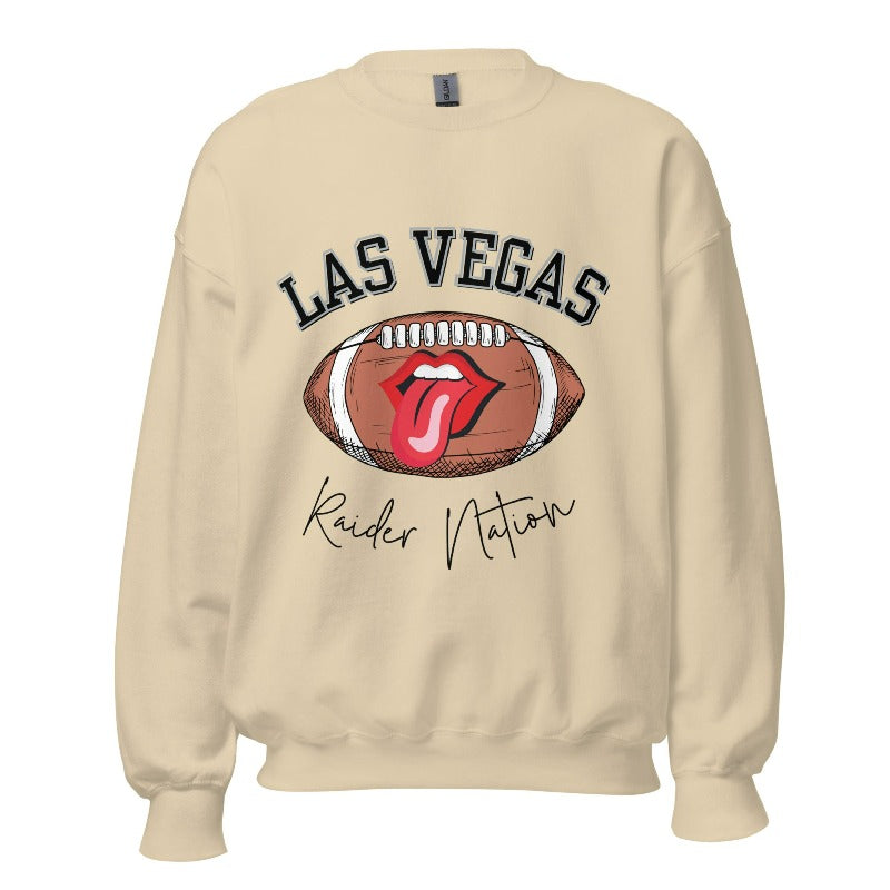 Get ready to support the Las Vegas Raiders in style with our premium sweatshirt, featuring the team's name and iconic slogan, "Raider Nation." On a sand colored sweatshirt. 