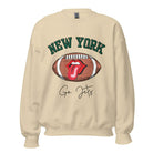 Gear up for game day with this New York Jets sweatshirt, featuring a football and playful lips and tongue design. Emblazoned with the team's rallying cry "Go Jets" and the iconic wordmark New York, on a sand colored sweatshirt. 