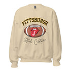 Geer up for game day with this Pittsburgh Steelers sweatshirt, featuring a football and playful lips and tongue design. Emblazoned with the team's iconic slogan "Steel Curtain" and the distinctive Pittsburgh wordmark, on a sand colored sweatshirt. 